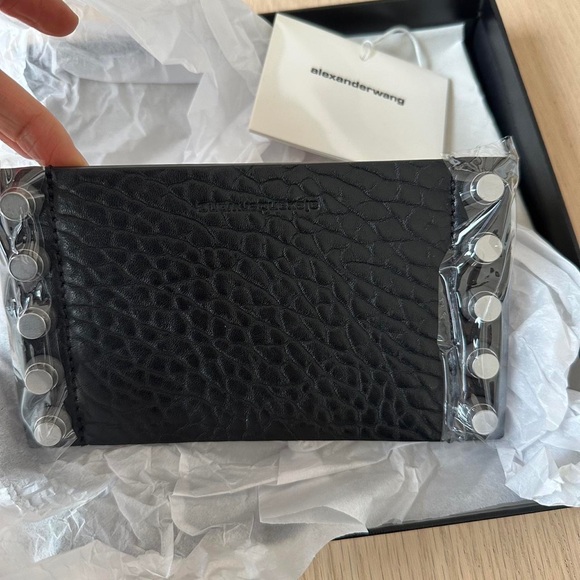 Alexander Wang Trap Stud Candle Sleeve 
Black lambskin leather sleeve